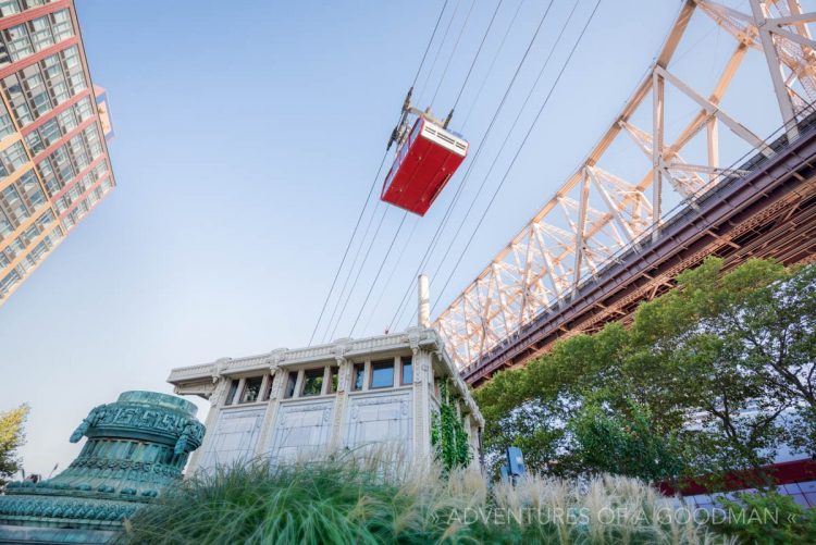 The Roosevelt Island Tram soars above the Historical Society kiosk