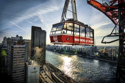 The Tram soars above Roosevelt Island, in the middle of the East River in NYC