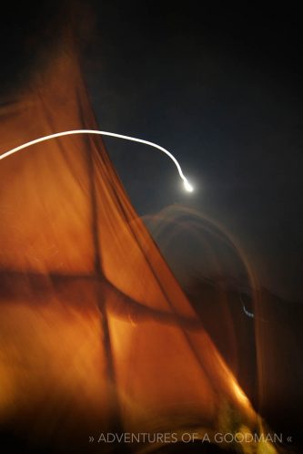 A light trail from a headlamp outside the Arba Mistika teepee