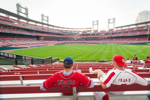 St Louis Cardinals fans hang out in the centerfield bleachers of Busch Stadium during batting practice