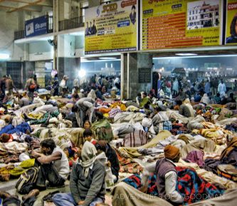 Hundreds of people sleep on the floor while stranded overnight in a Varanasi train station