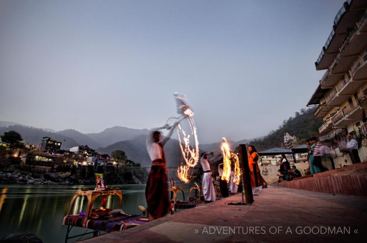 Local holy men perform a puja alongside the Ganges (Ganga) River in Rishikesh, India