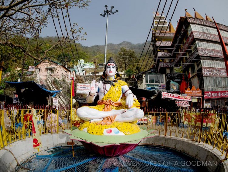 Shiva sits at the end of the Laxshman Jhula Bridge in Rishikesh, India