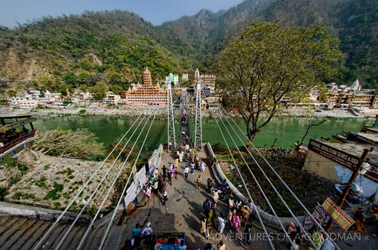 The scenic town of Rishikesh, India, with the foothills of the Himalayas as a background.