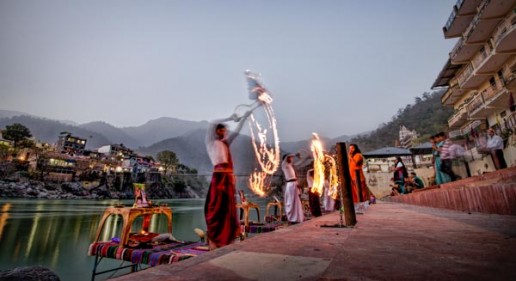 Local holy men perform a puja alongside the Ganges (Ganga) River in Rishikesh, India