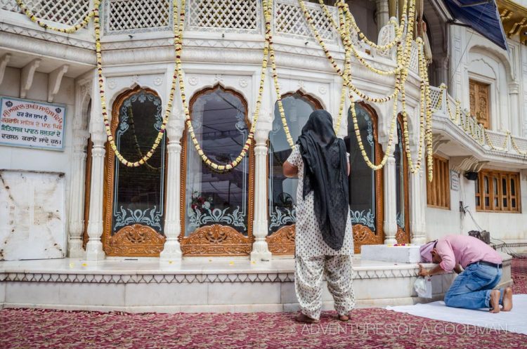 Devotees pray at a shrine at the Sri Harmandir Sahib Golden Temple complex in Amritsar, India