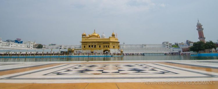 Clean feet are required to walk on the marble floors alongside the Golden Temple