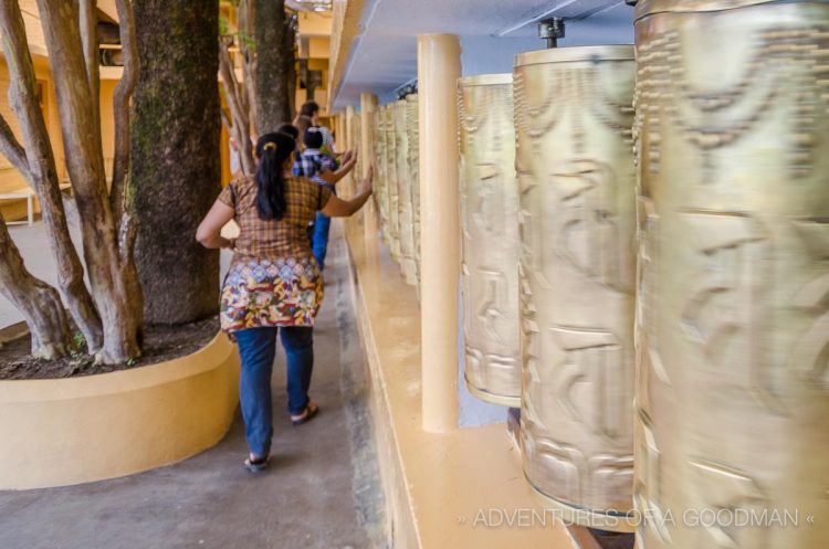 Devotees spin prayer wheels at Tsuglagkhang: the temple inside the Dalai Lama compound