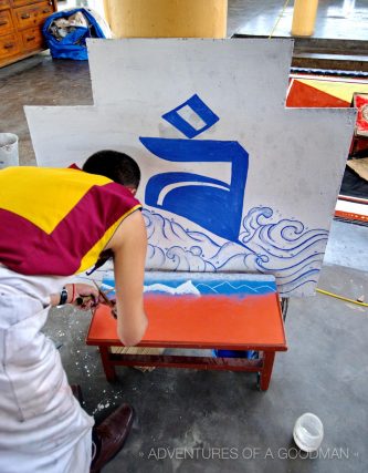 Monks working on sand mandalas at the Dalia Lama Complex in McLeod Ganj, India