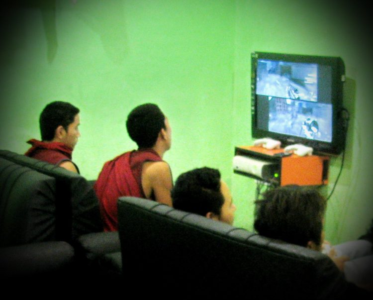 Monks playing video games in McLeod Ganj, India