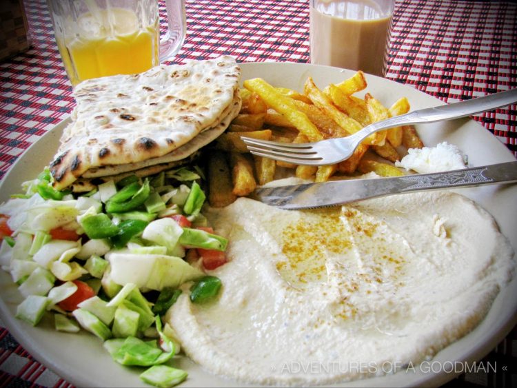 An "Israeli Breakfast" consists of hummus, french fries, salad and pita ... which is basically a piece of folded naan