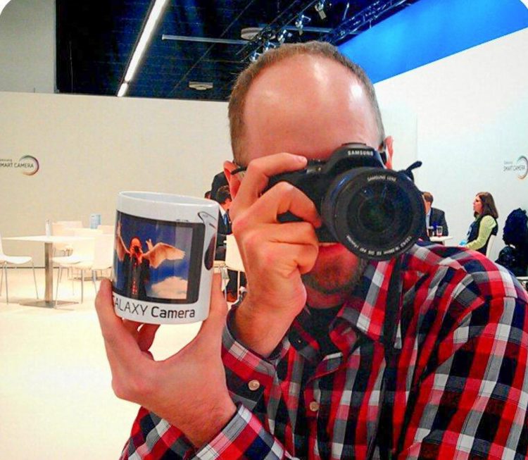 Me with my Samsung NX20 and a mug of me as an angel using the camera