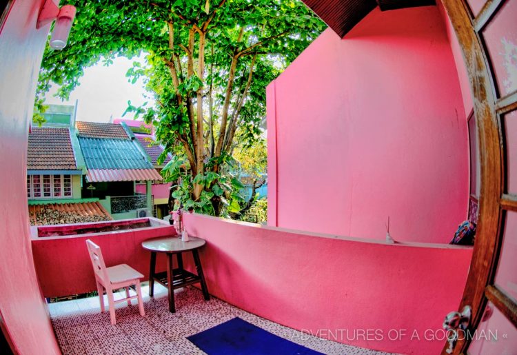 The upstairs back patio and our shared back yard.