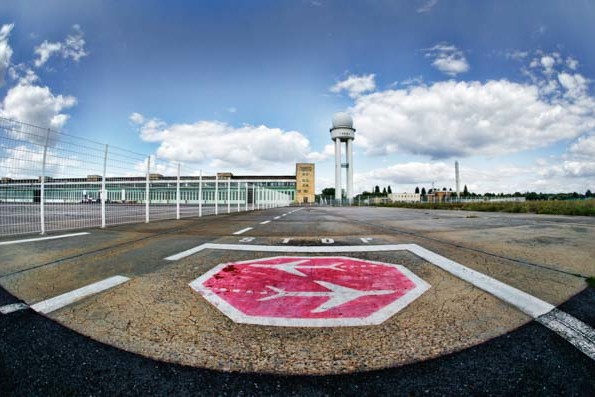 An old painted logo on the runway of Tempelhofer Park and Airport in Berlin, Germany