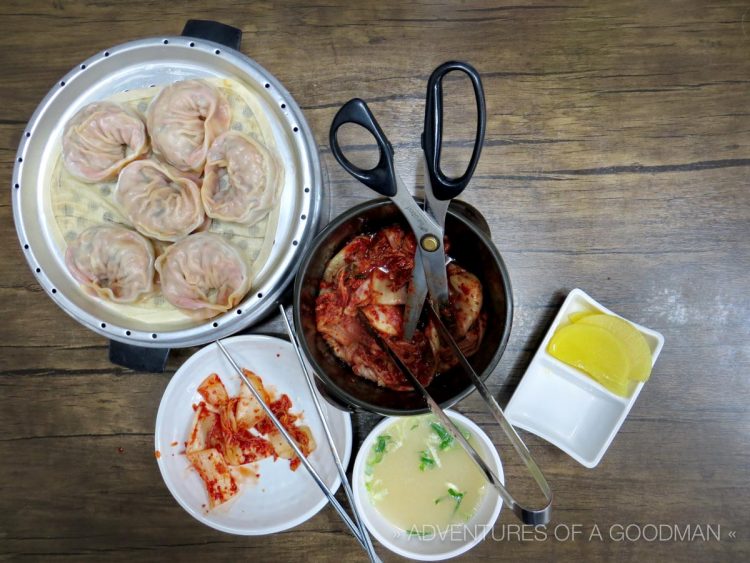 My first meal in Korea – Kimchee dumplings, soup, cuttable kimchee and some yellow thing