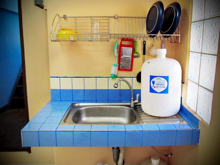 Our sink at the Pink House with our water jug of drinkable water for 25 baht per jug – 83 cents