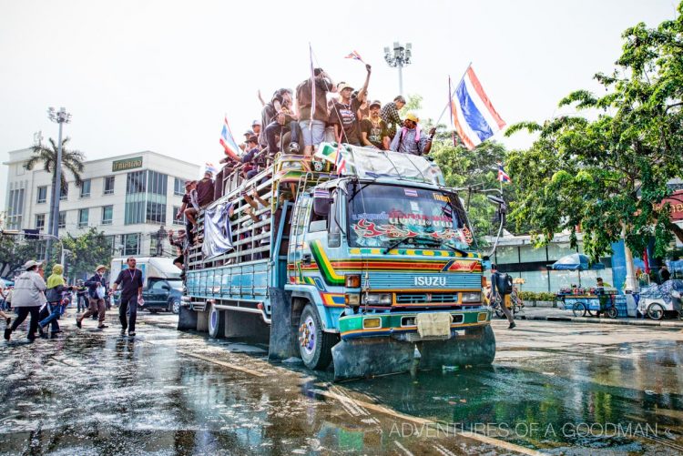 Bangkok's anti-government protesters move around town on giant trucks