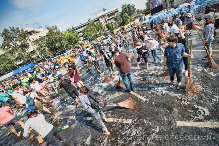 Meanwhile, thousands of protesters picked up brooms and cleaning supplies to make the street spotless.