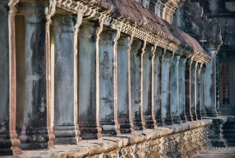 Large columns line the outer gallery hallways of Angkor Wat