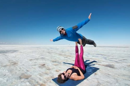 My wife, Carrie, and I do acro yoga in the Bolivian Salt Flats