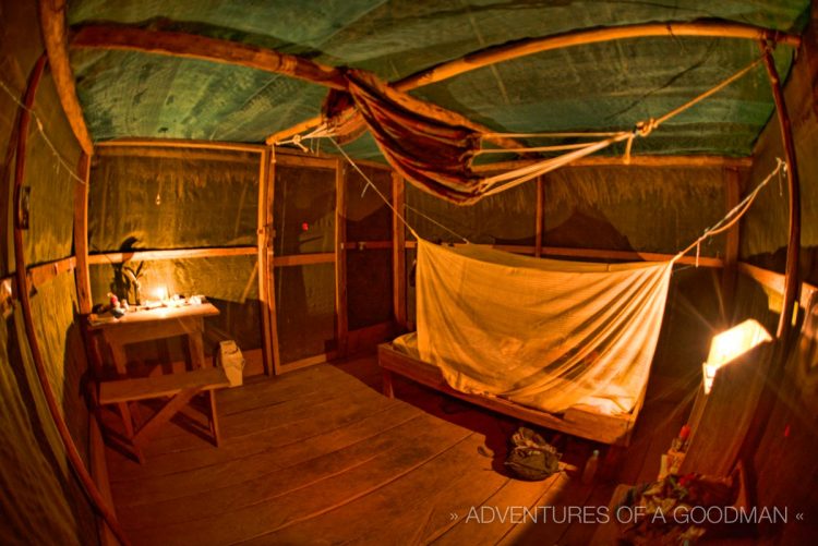 It doesn't get more "off the grid" than the inside of my hut: a desk, stool, shelf, hard bed and mosquito net.