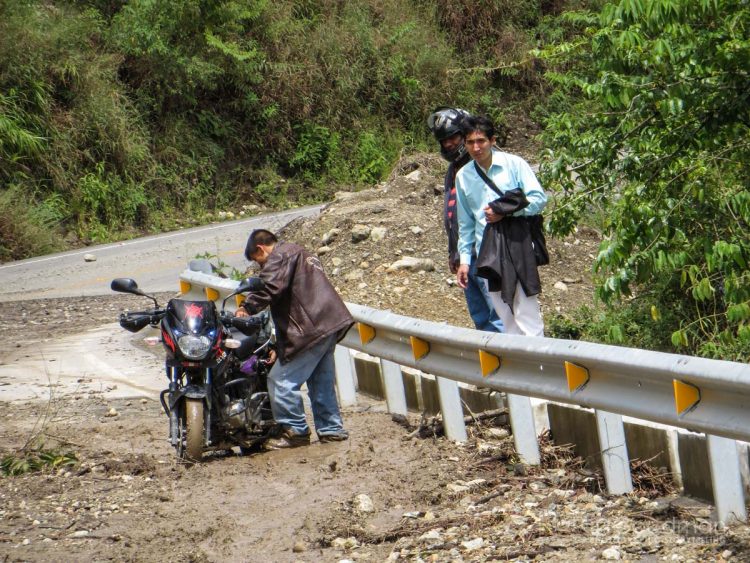 Motorcycles were the only vehicle that could pass through the landslides... but their going sure was tough.