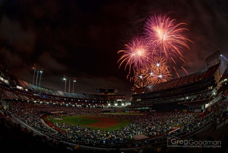 Fireworks boom above the O.co Coliseum after an Oakland A's baseball game.