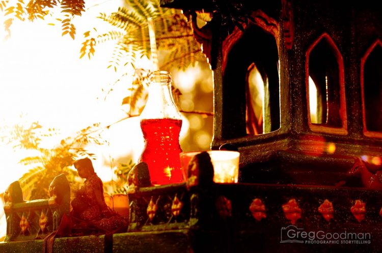 Sunshine and offerings on a shrine near the 12,999 Monk Alms Procession in 2013