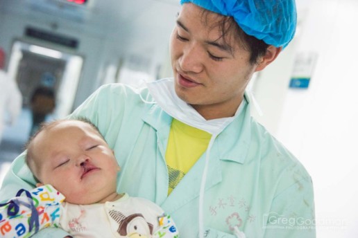 A father is reunited with his son after cleft lip surgery in Xingyi, China