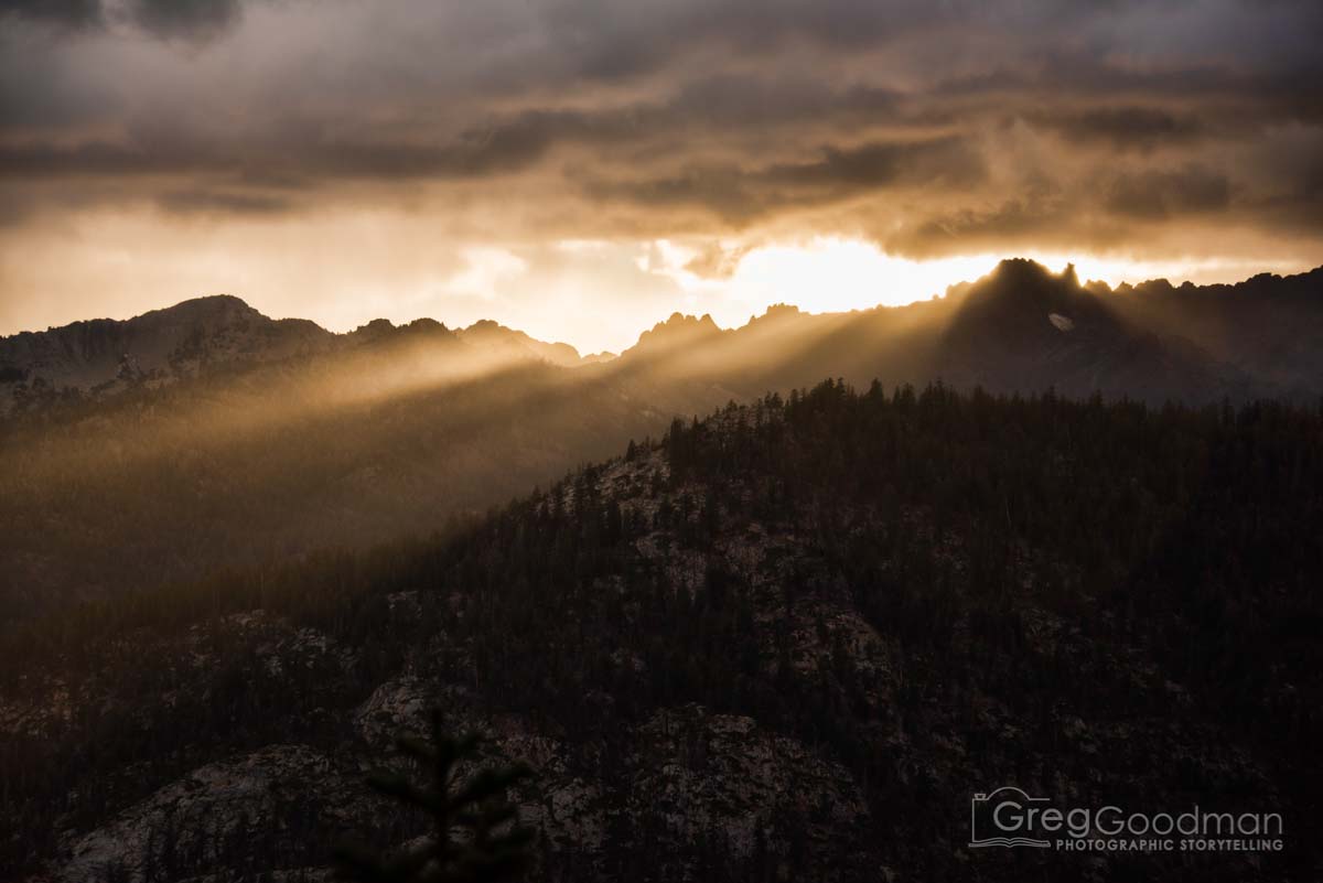 The day’s last light peeks through the clouds above Mammoth Mountains, California
