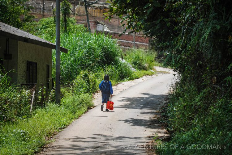 A young girl walks through a town in the Cameron Highlands, Malaysia
