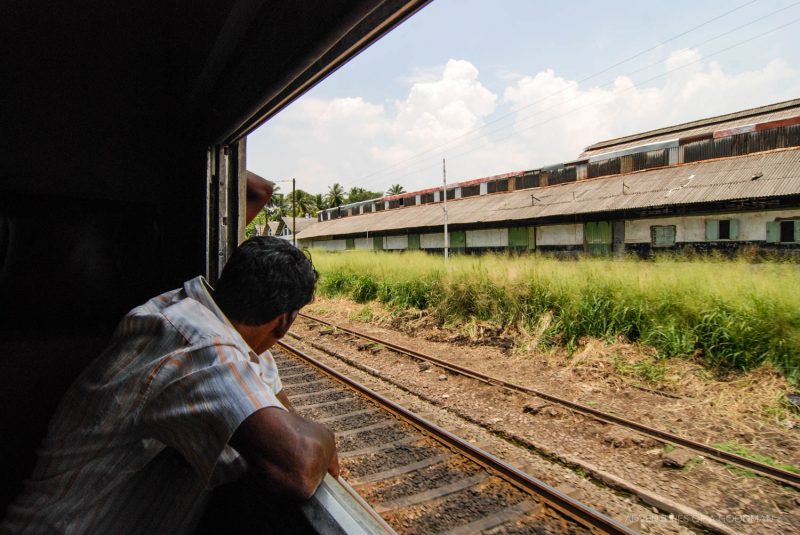 Looking out the window on a Sri Lankan train