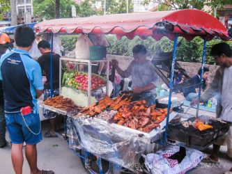 A meat on a stick vendor in Bangkok, Thailand