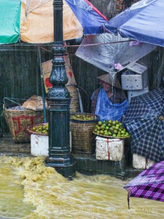 Monsoon rains flow down the streets of Sapa in Vietnam