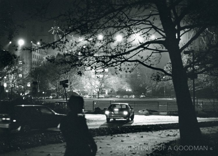 A local man watches the filming of Conspiracy Theory on Roosevelt Island in New York City