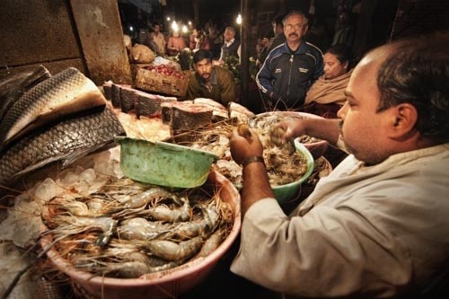 A fish vendor at the Chittaranjan Park market in New Delhi, India