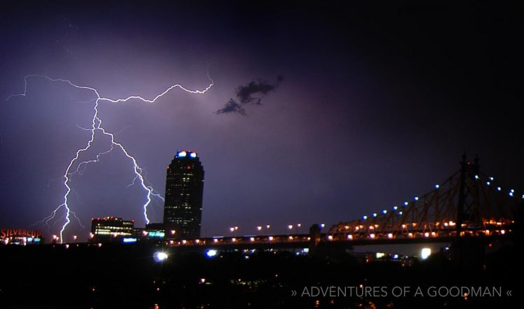 A split lightning bolt crashes behind the Citi building in Queens, NY