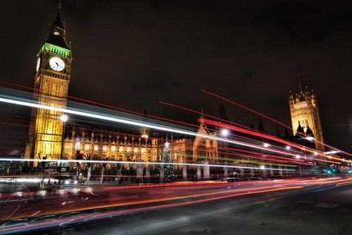 London's Big Ben clocktower, as seen at night from the busy streets below