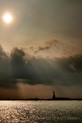 The Statue of Liberty at sunset, as seen from the New York City harbor