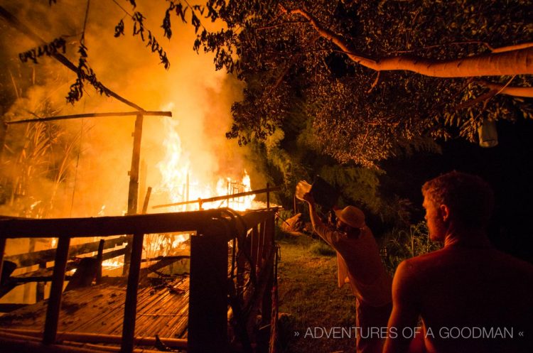 Members of the bucket brigade hard at work dousing a bungalow with water to stop the spread of the blaze