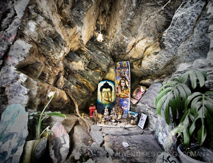A shrine hidden in the mountainside outside the Shiva Cafe, on top of the Bhagsu Waterfall in McLeod Ganj, India