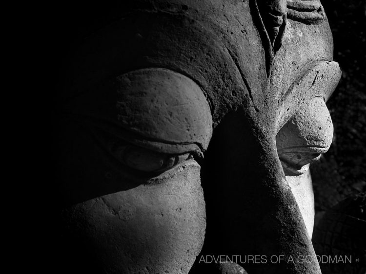 The black and white version of my photograph of a Buddha's face at the Baan Phor Liang Meun's Terra-Cotta Arts garden in Chiang Mai, Thailand