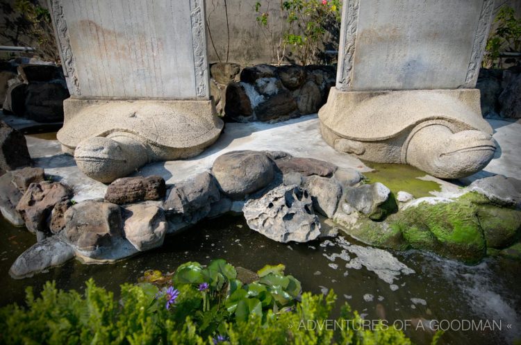 Nine turtle statues line the fish pond in front of Chihkan Tower