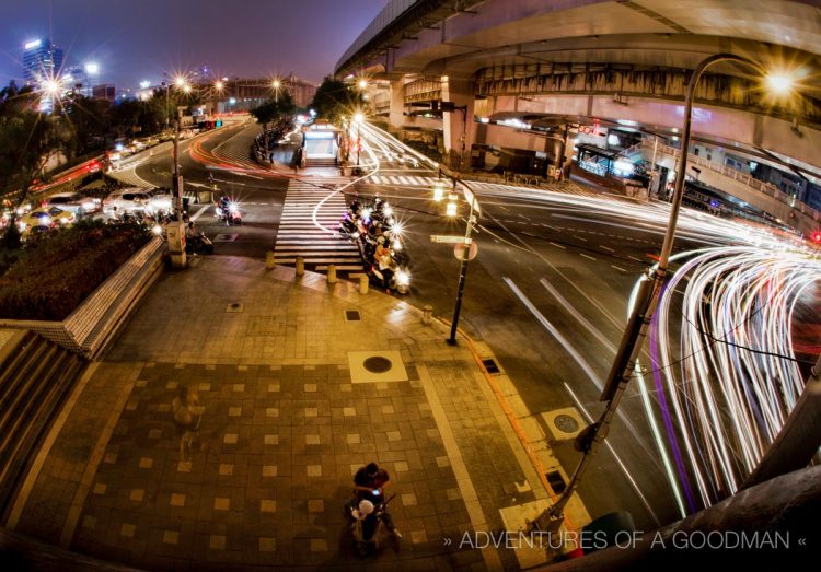 Traffic zooms by an MRT subway station in downtown Taipei, Taiwan