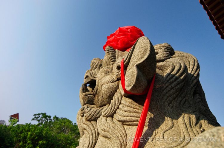 A traditional Chinese guardian lion sits outside the entrance to Fort Zeelandia