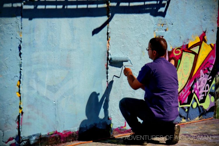 Repainting the wall for fresh art at The Institute of Higher Burning