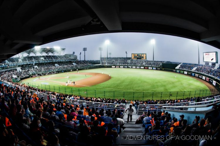 Fans of the Lions cheer on their team in the lower level of Taoyaun International Baseball Stadium