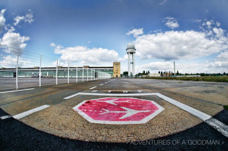 An old painted logo on the runway of Tempelhofer Park and Airport in Berlin, Germany