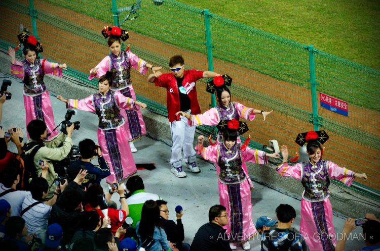 Cheerleaders at a Taiwanese baseball game change costumes several times a night