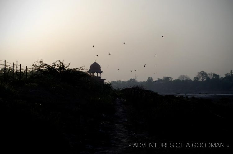 The fenced off walkway separating Mehtab Bagh from the Taj Mahal